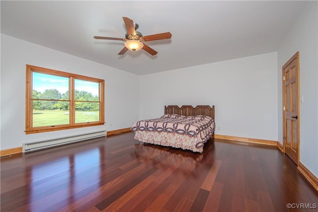 bedroom featuring dark hardwood / wood-style floors, ceiling fan, and a baseboard heating unit