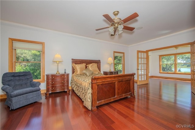 bedroom featuring hardwood / wood-style flooring, ceiling fan, crown molding, and french doors