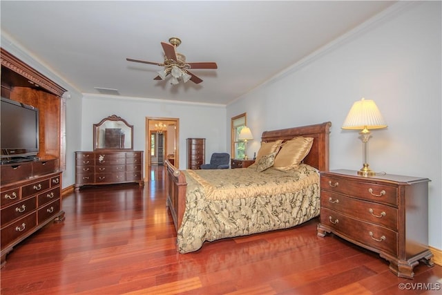 bedroom featuring crown molding, ceiling fan, and dark hardwood / wood-style floors