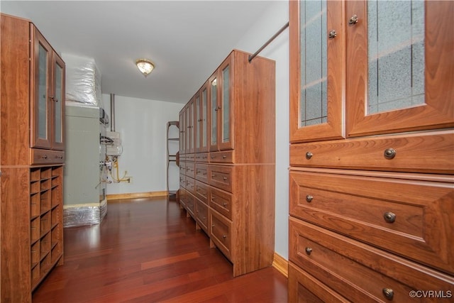 corridor featuring dark hardwood / wood-style flooring