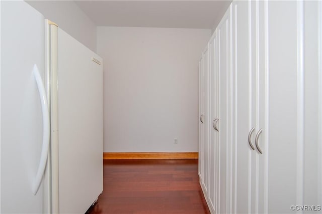 hall with dark hardwood / wood-style floors