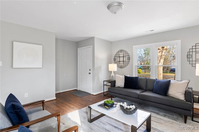 living room featuring dark hardwood / wood-style floors