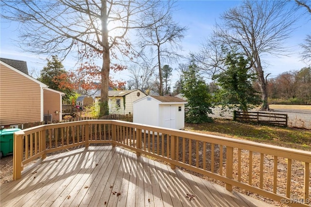 wooden deck featuring a storage shed