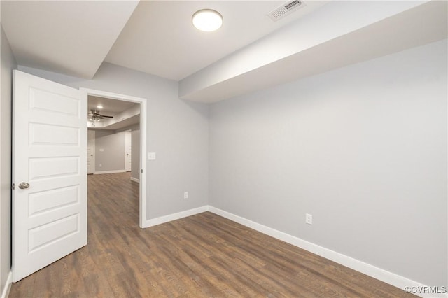 spare room with dark hardwood / wood-style flooring