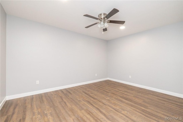 empty room featuring ceiling fan and wood-type flooring