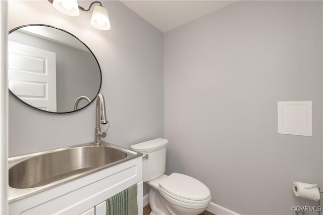 bathroom with toilet and sink