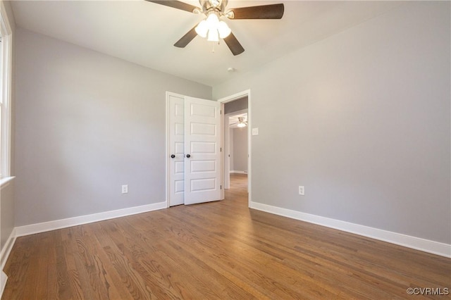 spare room featuring hardwood / wood-style floors and ceiling fan