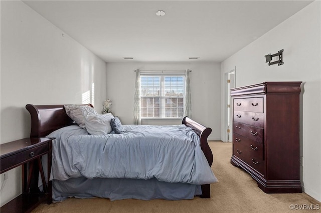 bedroom with light carpet