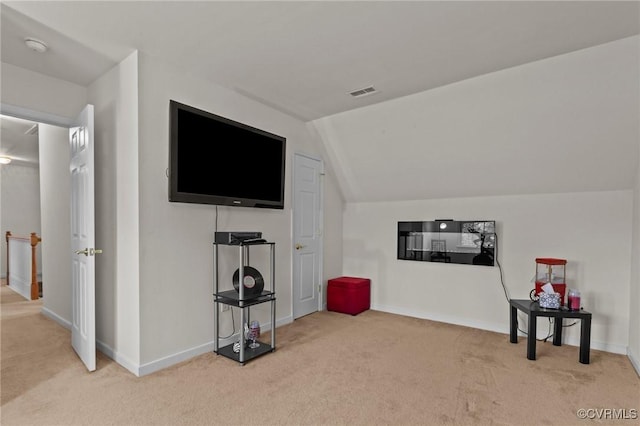 interior space with carpet floors and lofted ceiling