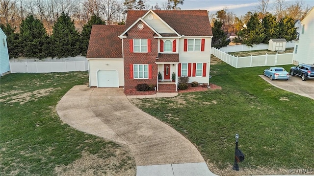 view of front of home with a garage and a front lawn