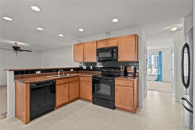 kitchen with ceiling fan, sink, tasteful backsplash, kitchen peninsula, and black appliances