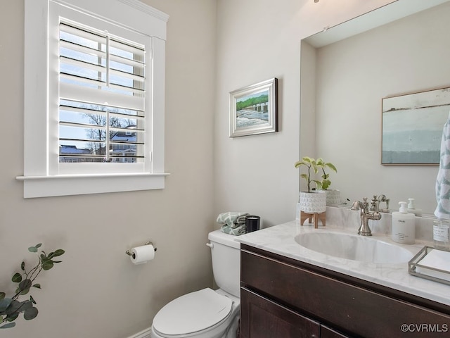 bathroom with toilet and vanity