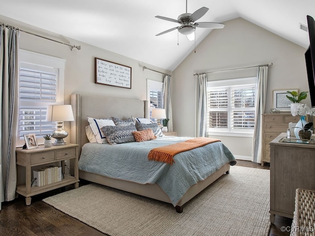 bedroom with lofted ceiling, ceiling fan, and dark wood-type flooring