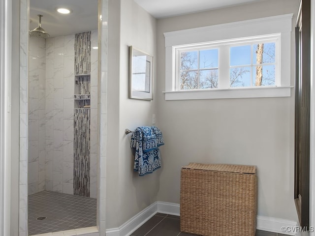 bathroom with a tile shower