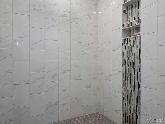 bathroom with a tile shower