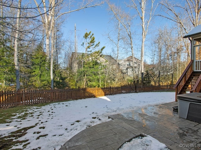 view of yard layered in snow