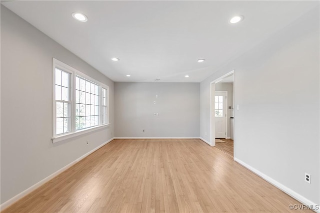 spare room featuring light wood-type flooring