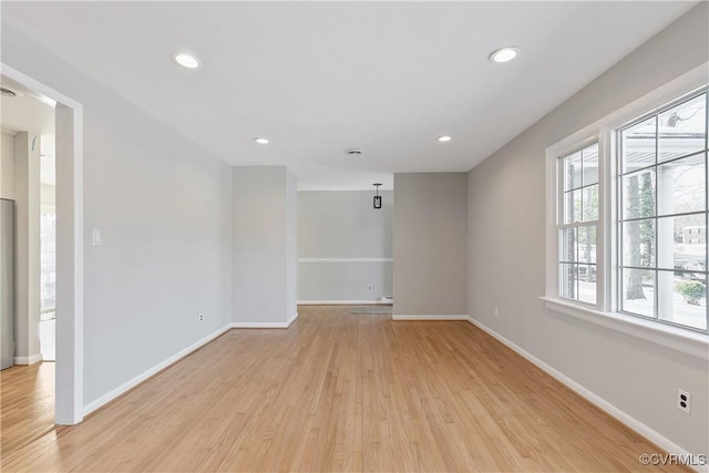 unfurnished room featuring light hardwood / wood-style flooring