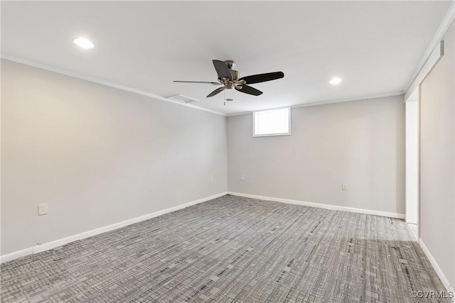 unfurnished room featuring ceiling fan and crown molding