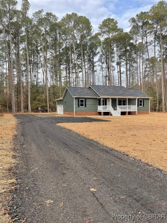 view of front of property featuring a garage and covered porch