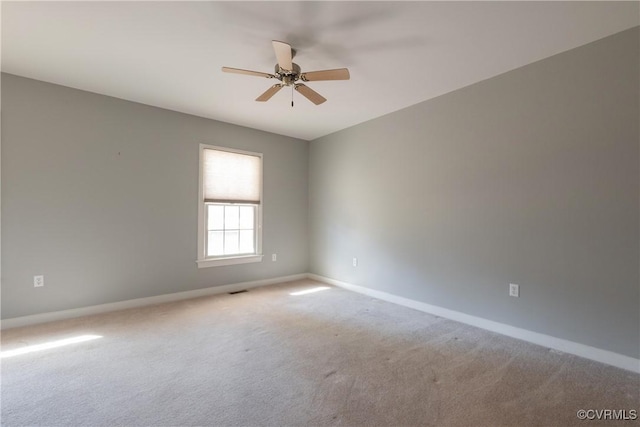 unfurnished room featuring carpet floors and ceiling fan