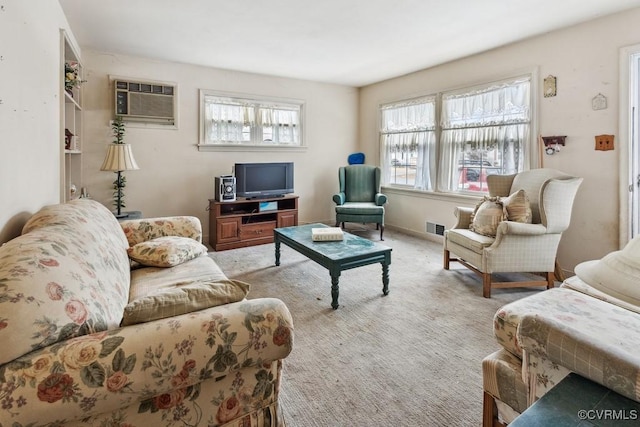 carpeted living room with a wealth of natural light and an AC wall unit