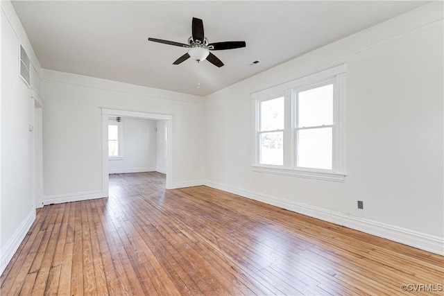 spare room featuring hardwood / wood-style flooring and ceiling fan