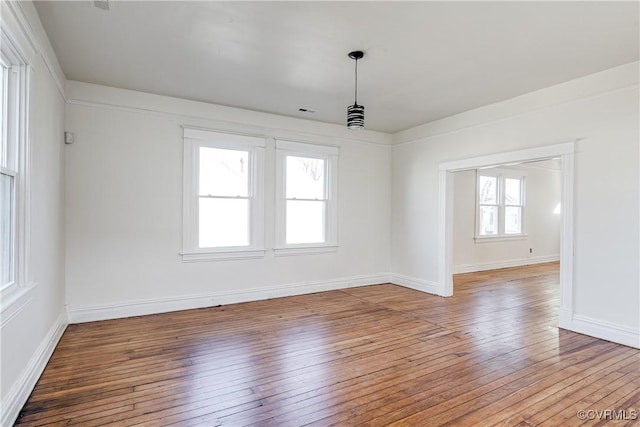 spare room featuring hardwood / wood-style floors