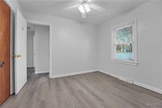 spare room with ceiling fan and light hardwood / wood-style flooring