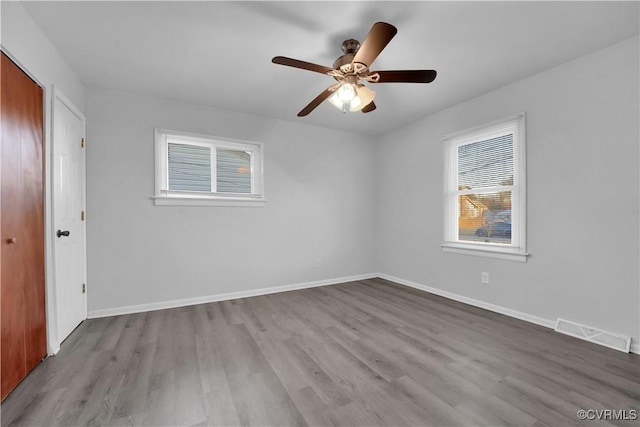 spare room featuring ceiling fan and light hardwood / wood-style flooring