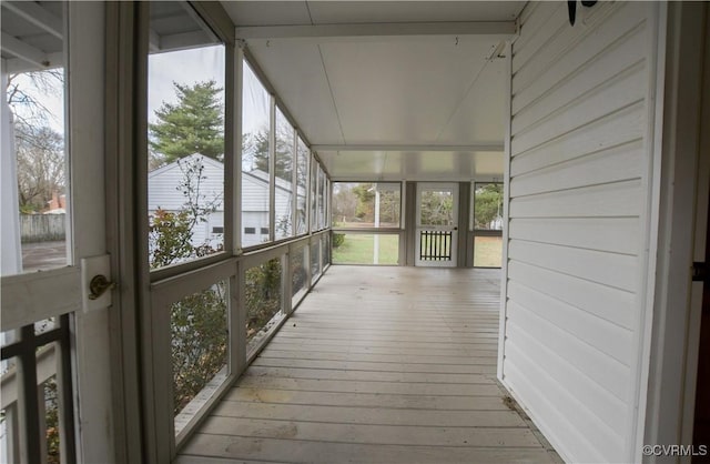 unfurnished sunroom featuring plenty of natural light