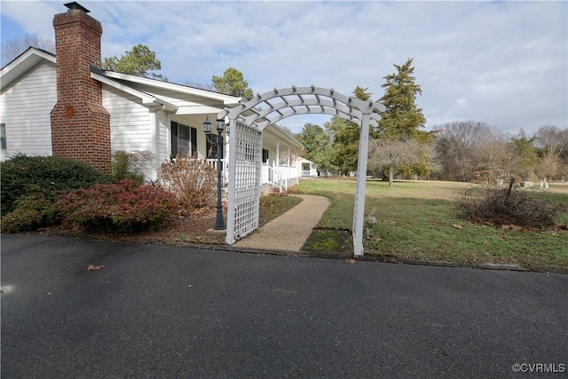 view of property exterior featuring a lawn