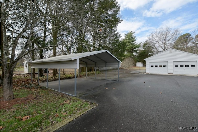 view of car parking featuring a carport and a garage