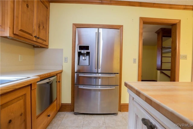 kitchen featuring light tile patterned floors and appliances with stainless steel finishes