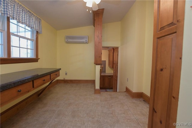 hallway featuring a wall mounted air conditioner and lofted ceiling