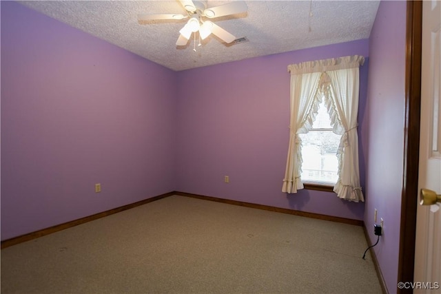 empty room featuring carpet, a textured ceiling, and ceiling fan