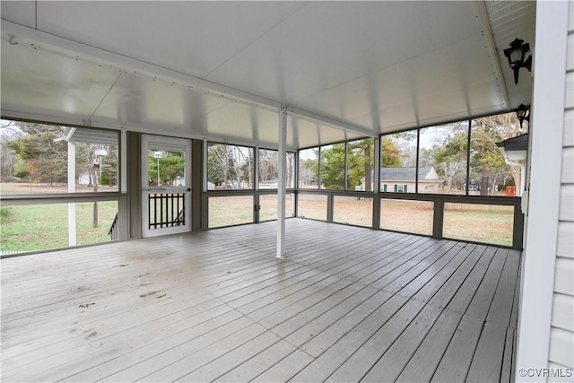 unfurnished sunroom with plenty of natural light