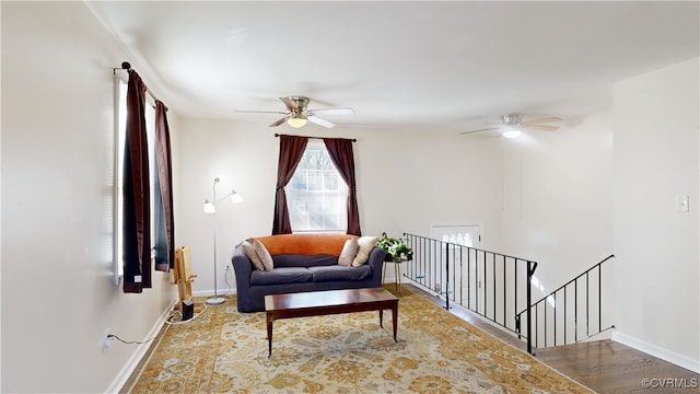 living area with ceiling fan