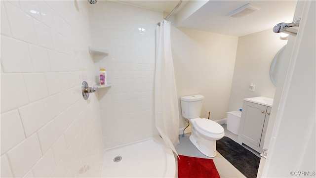 bathroom featuring vanity, toilet, and walk in shower