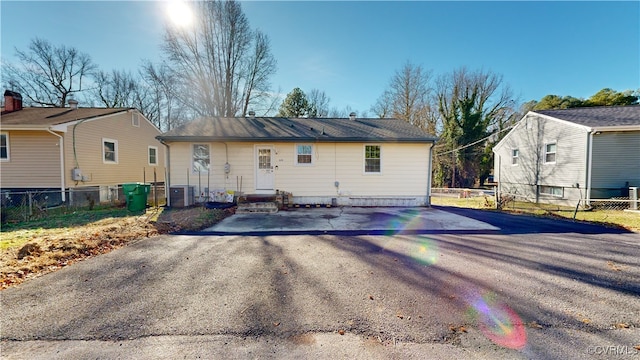 back of property with central AC unit