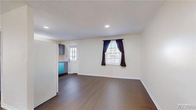 unfurnished room featuring dark hardwood / wood-style floors