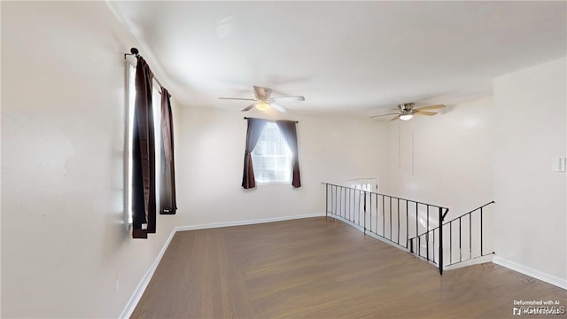 unfurnished room with ceiling fan