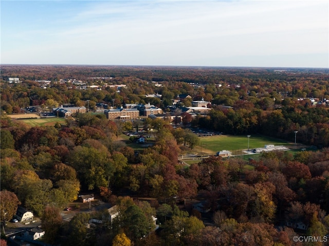 birds eye view of property with a wooded view