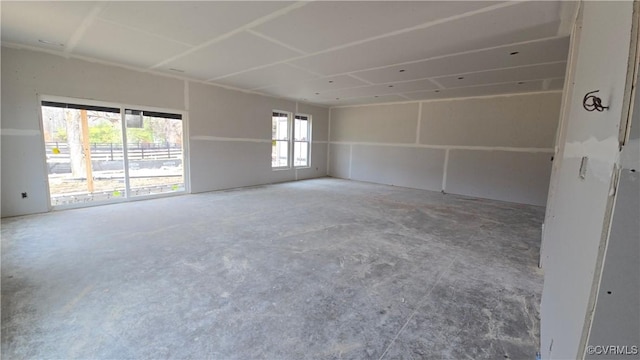 unfurnished room featuring concrete floors