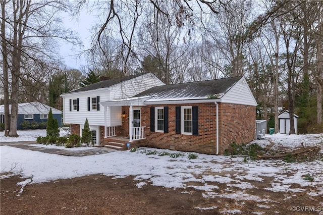 view of front of property with a shed