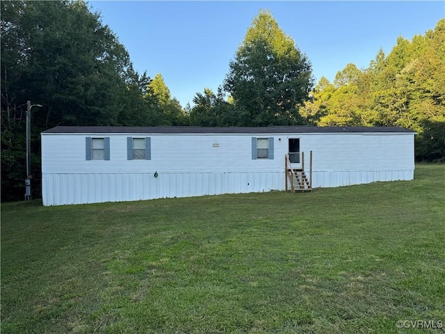 view of outbuilding featuring a yard