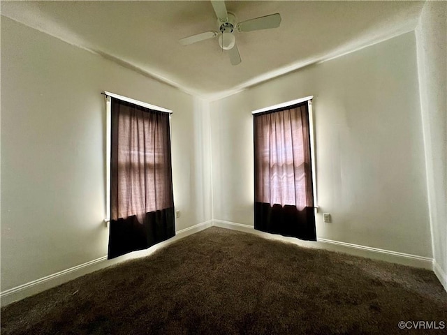 empty room with ceiling fan and carpet floors