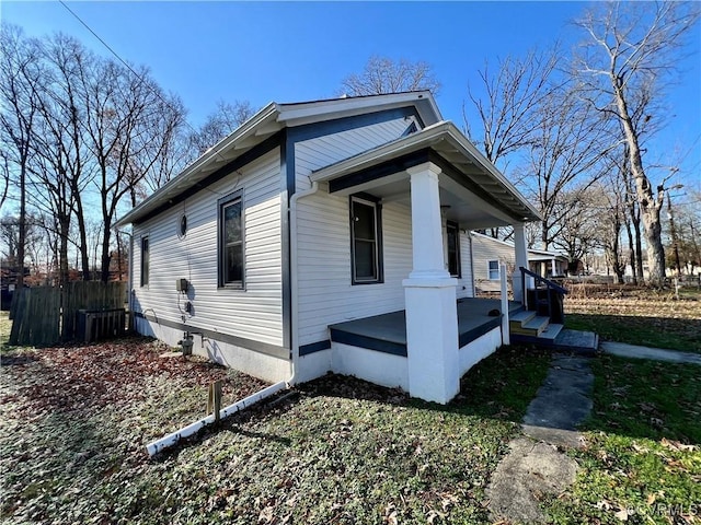 view of property exterior with covered porch