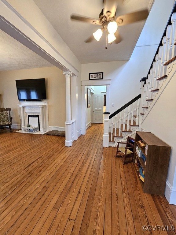 interior space with light wood-type flooring and ceiling fan