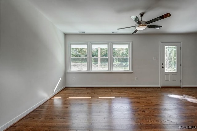 interior space featuring ceiling fan and dark wood-type flooring